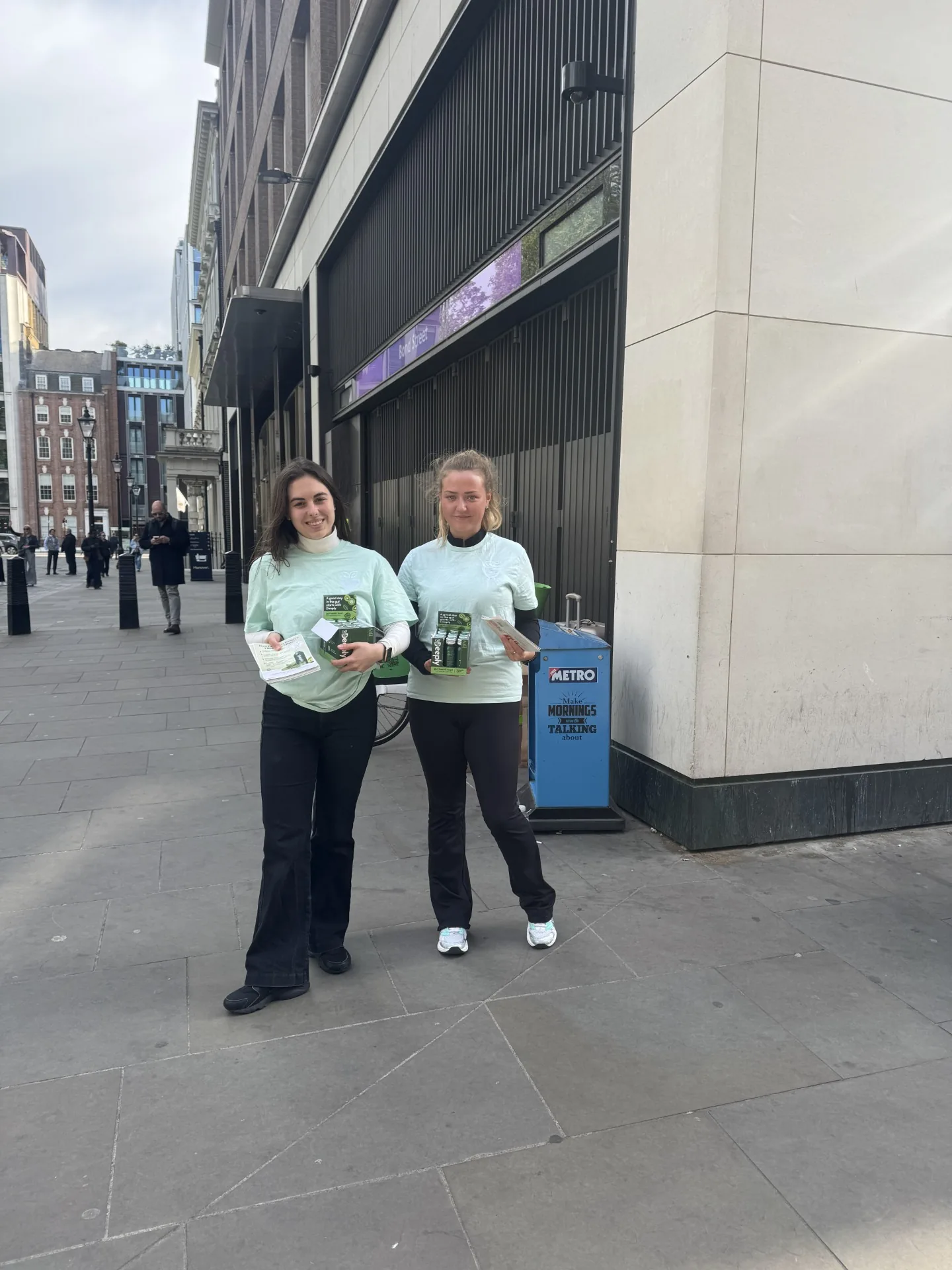 Sampling & Trial: Two FOTS brand ambassadors in Deeply T-shirts handing out Deeply samples and leaflets on Bond Street, London