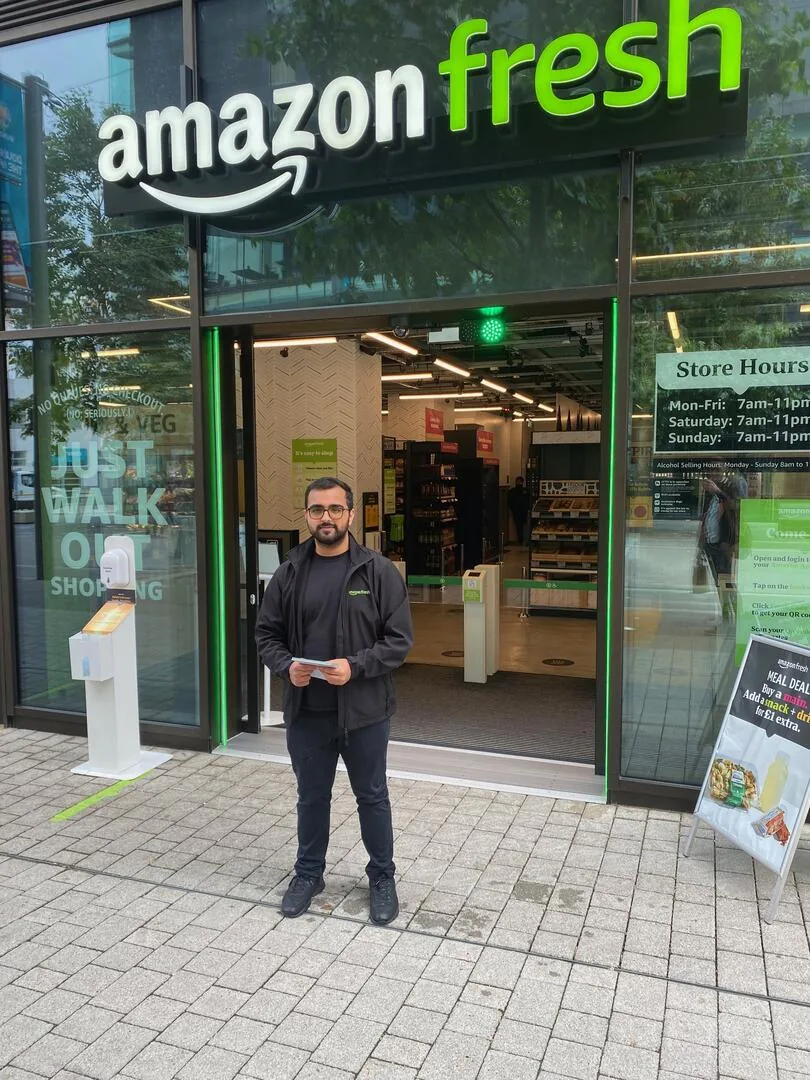FOTS team member in Amazon Fresh uniform outside the Amazon Fresh store in Wembley